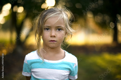 Portrait of girl standing outdoors photo