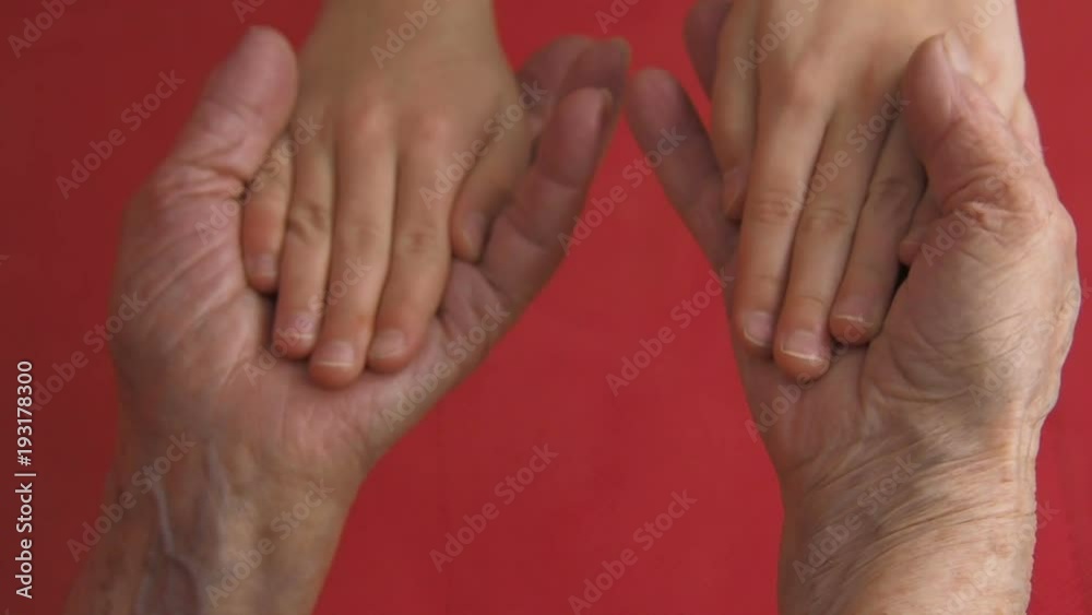 Hands of the elderly. Grandmother hugs the child's hands. Hands of the elderly. Grandmother hugs the child's hands.
