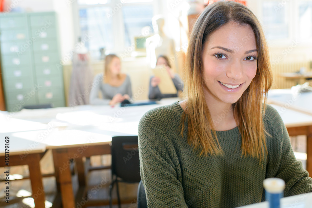 woman smiling in an office environment woman smiling in an office environment