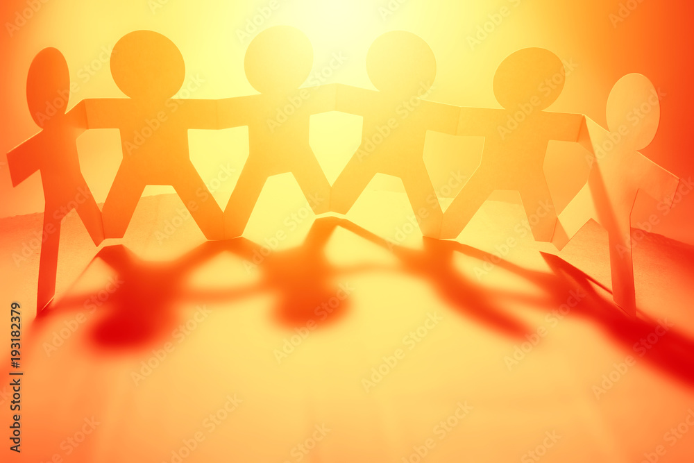 Paper chain team holding hands Paper chain team holding hands