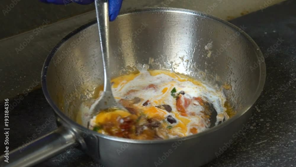 food preparing process. restaurant menu meal. chef cooking and stirring sauce in a pan food preparing process. restaurant menu meal. chef cooking and stirring sauce in a pan