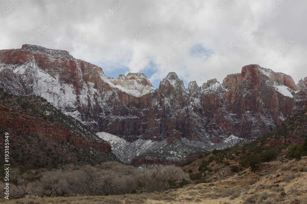 Winter snow clouds begin to break up above the mountains of Zion National Park in Southern Utah.