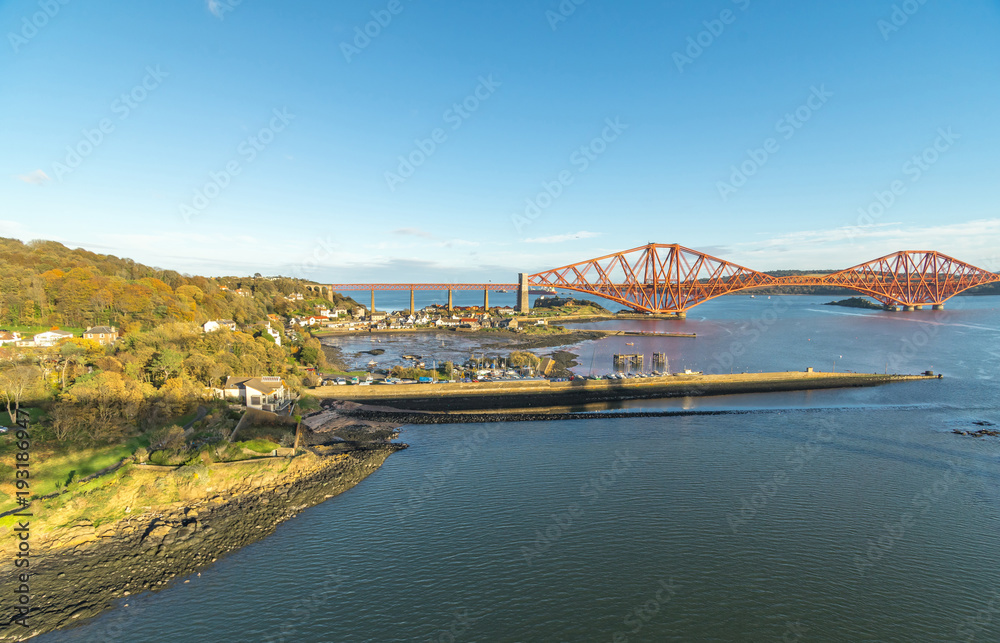 A view from the east footpath of the Forth Road Bridge, looking over North Queensferry towords the old and famous Rail Bridge.