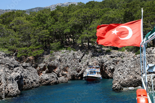 Tourists are visiting to phosphorous cave by sightseeing boats in Adrasan photo