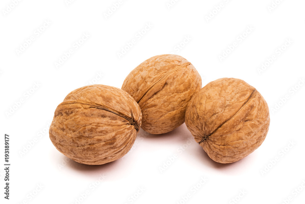 Group of walnuts on white. Healthy organic food concept. Group of walnuts on white. Healthy organic food concept.