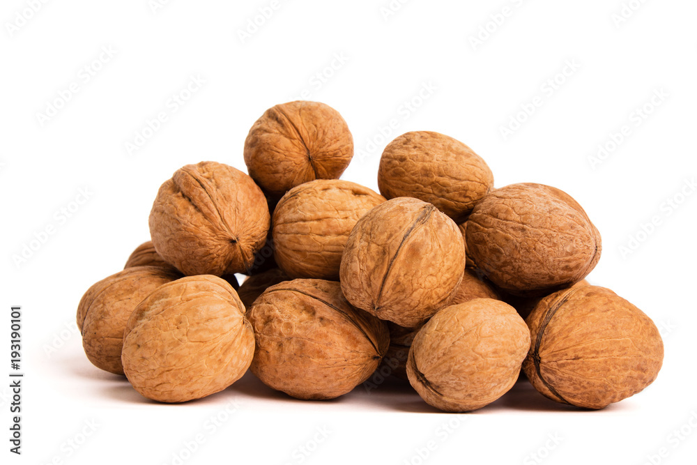 Group of walnuts on white. Healthy organic food concept. Group of walnuts on white. Healthy organic food concept.