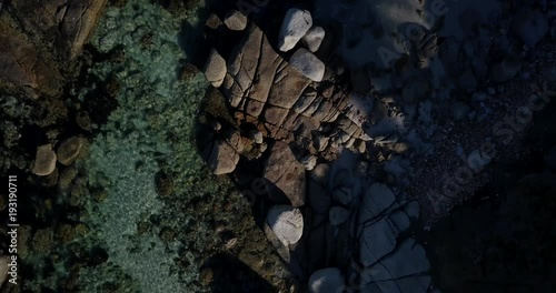 4K high quality aerial summer afternoon footage of Western Cape's coast, Simon's Town beach boulders, water, sandy sea front, Atlantic Ocean views in the background near Cape Town, South Africa