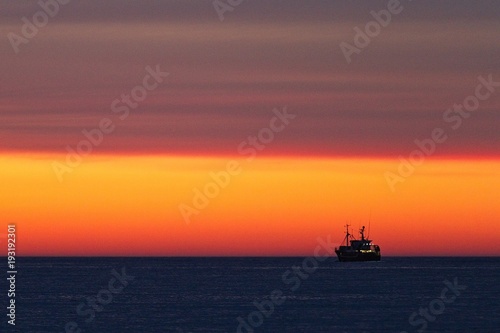 Fishing-boat during sunset