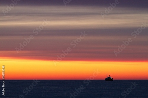 Fishing-boat during sunset © Rafal