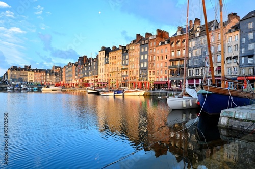 Dawn at the beautiful Honfleur harbor with boats and reflections, Normandy, France