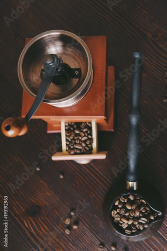 Roasted coffee beans in a copper Turk and coffee grinder 