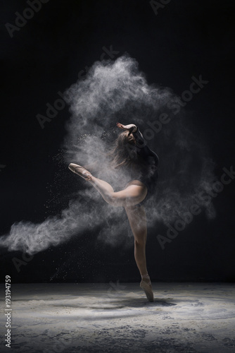 Woman in undrewear in dust cloud profile shot