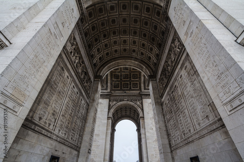  Arc de Triomphe (Triumph Arch) on place de l'Etoile in Paris, taken from below. It is one of the most famous monuments in Paris, standing on Champs Elysees on center of Place Charles de Gaulle..