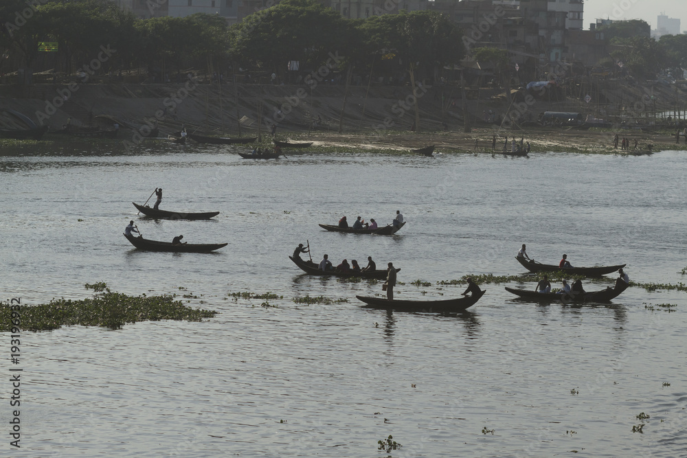 Dhaka / Bangladesh - November 2012: People are working in port of Dhaka during rush hours.