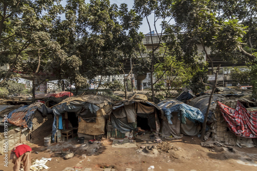 Dhaka / Bangladesh - November 2012: People live in slums just off the tracks in Dhaka Bangladesh.