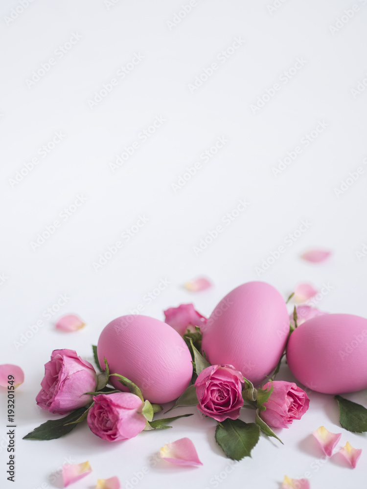 Easter greeting card with Easter eggs and pink roses on white background with copy space. Easter greeting card with Easter eggs and pink roses on white background with copy space.