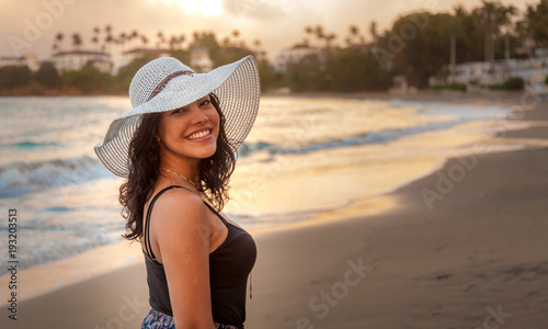Latina woman on holiday at the beach 4