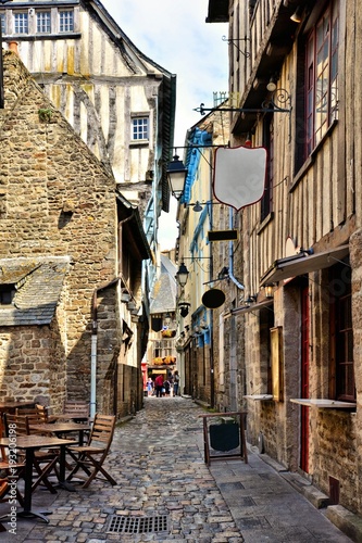 Fototapeta Naklejka Na Ścianę i Meble -  Street of half timbered buildings in the the historic town of Dinan, Bretagne, France