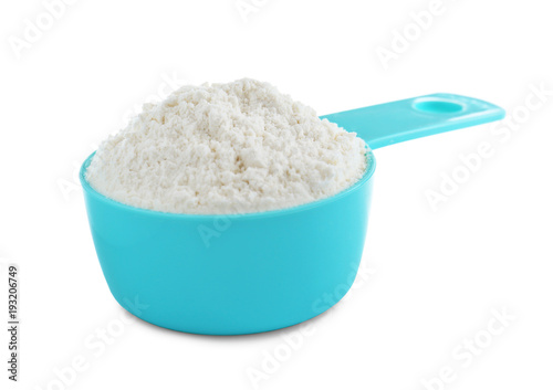 Scoop with flour on white background