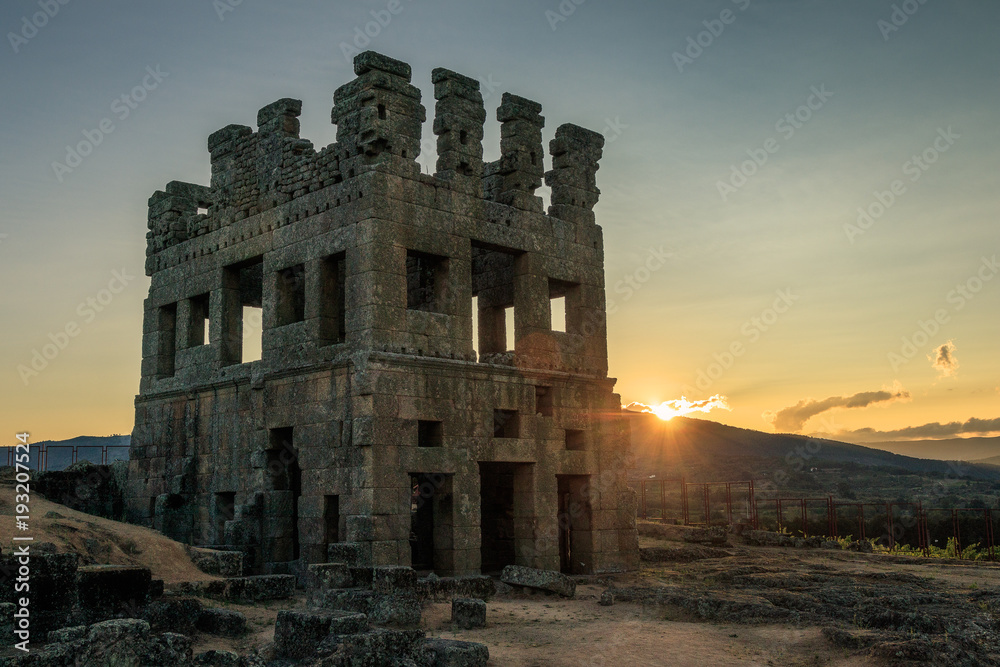 Roman ruins of the Centum Cellas tower near Belmonte, in Portugal, with a sunset in background. - Ruínas romanas da torre Centum Cellas perto de Belmonte, em Portugal, com um pôr do sol de fundo.