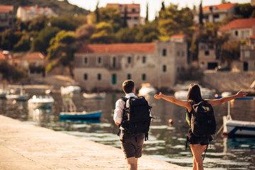 Young freelancing photographers enjoying traveling and backpacking.Photojournalism.Documentary travel photos.Lightweight travel photography gear,backpack and equipment.Low budget traveling experience