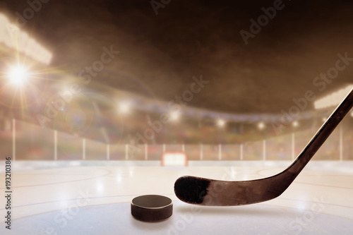 Outdoor Hockey Stadium With Stick and Puck on Ice photo