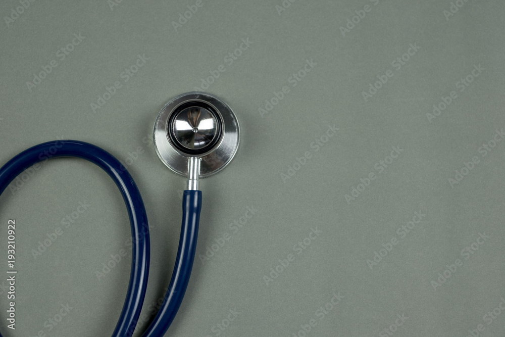 Stethoscope with blue tube on table top view with copy space. health and medical concept. - obrazy, fototapety, plakaty 