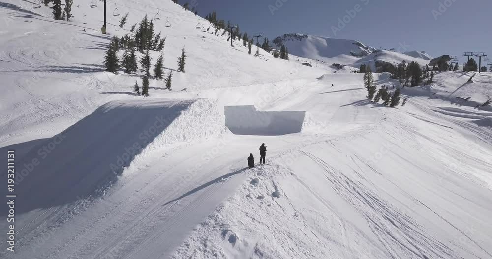 Skier spins in air, aerial shot Skier spins in air, aerial shot