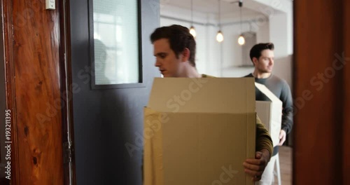 Young male couple moving home photo