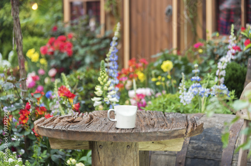 Wallpaper Mural Coffee cup and table in Backyard garden of residential house Torontodigital.ca