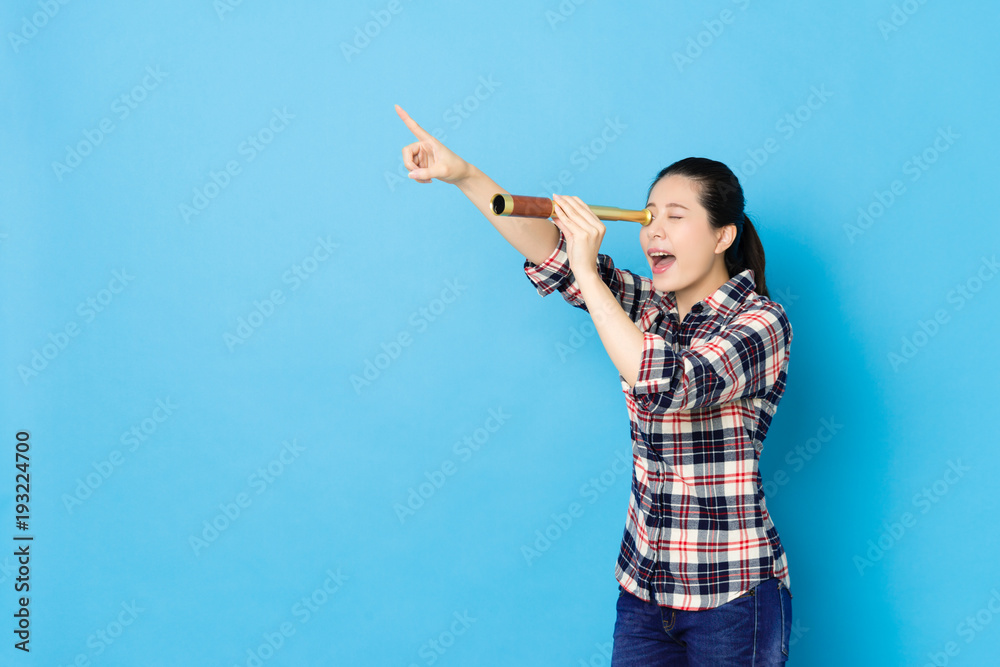 happy beautiful woman using stretch telescope tool happy beautiful woman using stretch telescope tool