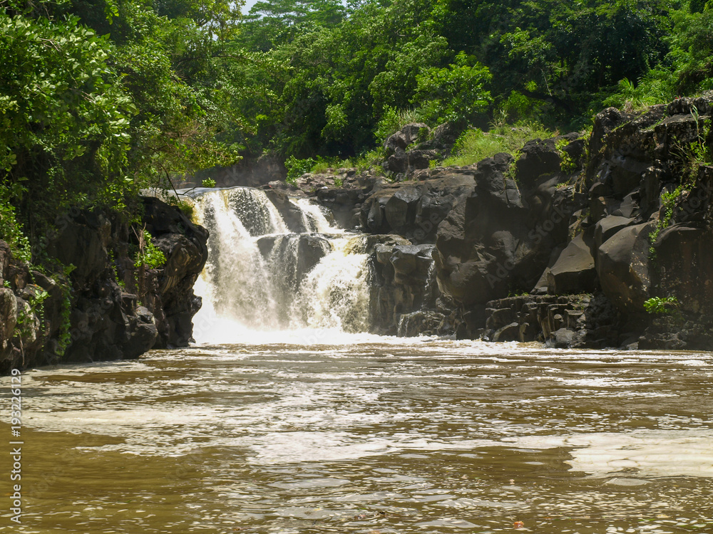 Fototapeta premium Waterfall at the beginning of the estuary of the Grand River South East on the island of Mauritius