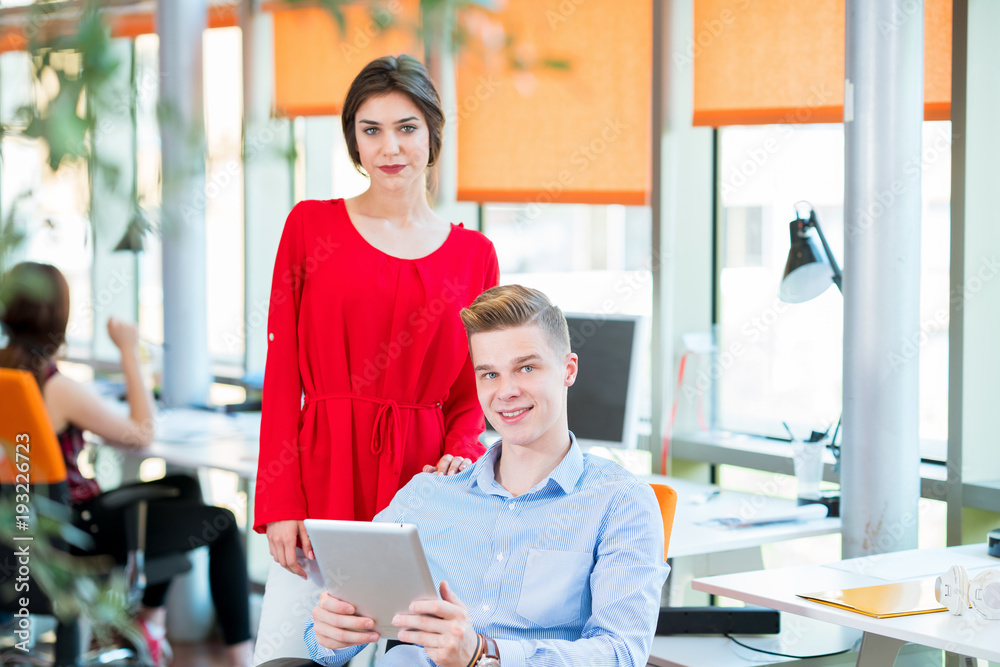 Obraz premium startup business, young creative people group brainstorming on meeting at office interior and using laptop and tablet computer to note ideas plans and projects