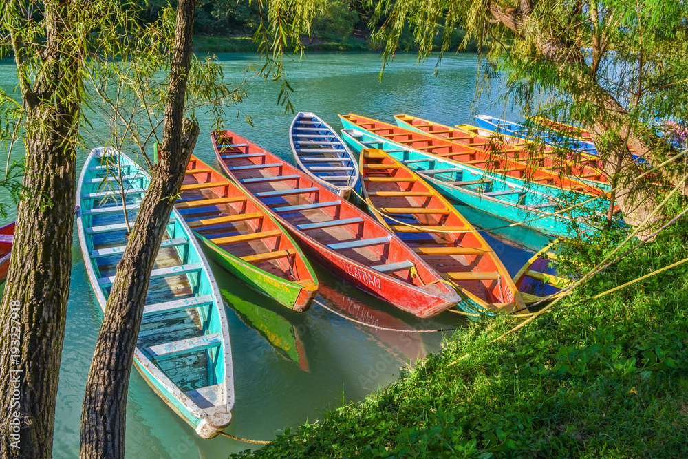 Colorful canoes in Tamul river at Huasteca Potosina, Mexico Stock Photo