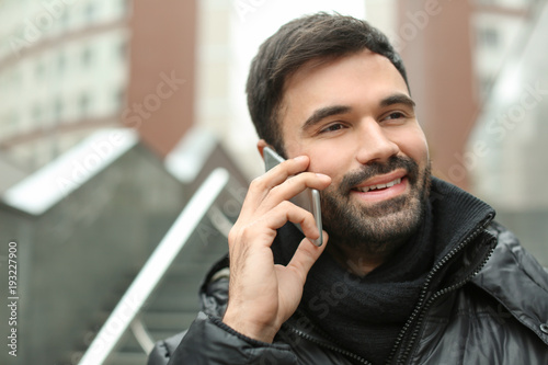 Young man talking on mobile...