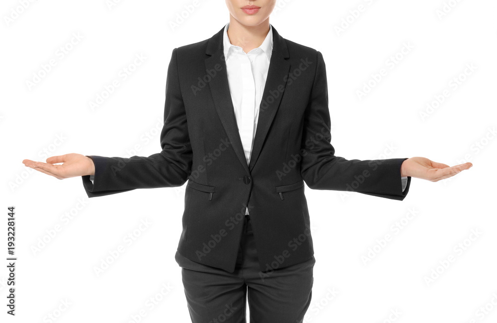 Young businesswoman showing balance gesture on white background Young businesswoman showing balance gesture on white background