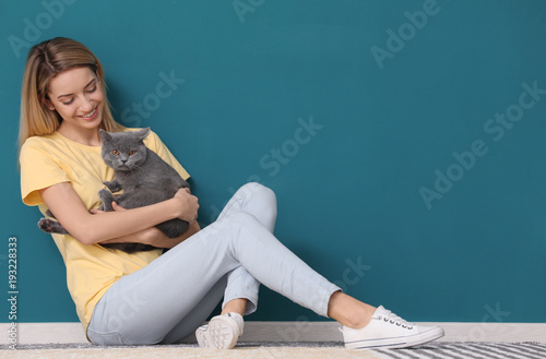 Young woman with cute pet c...