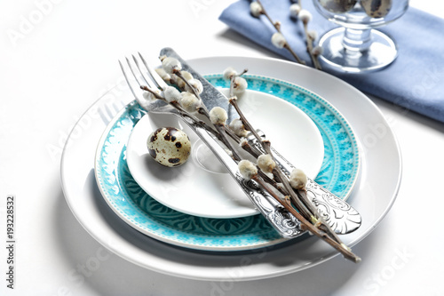 Beautiful festive Easter table setting on white background