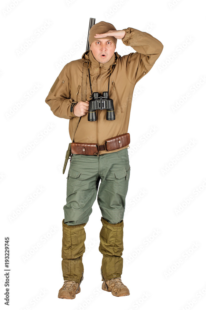 Full length portrait of a male hunter with double barreled shotgun Isolated on white background. hunting and people concept.