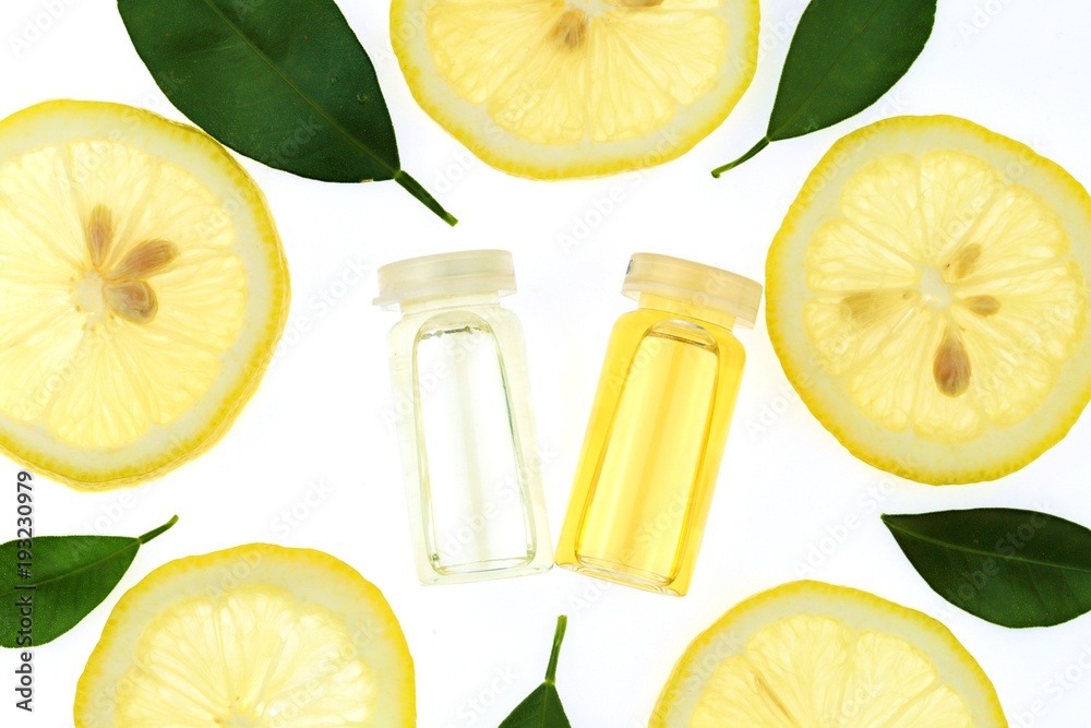Vitamin C. Serum with vitamin C, lemon oil, slices of fresh lemon on a