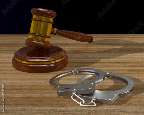 wooden gavel and handcuffs ...