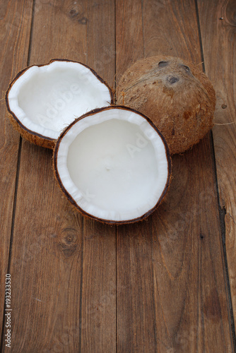 Coconut isolated on the wooden background. Tropical fruit coconut
