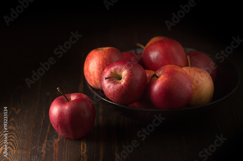 Red apples fruit on a dark background