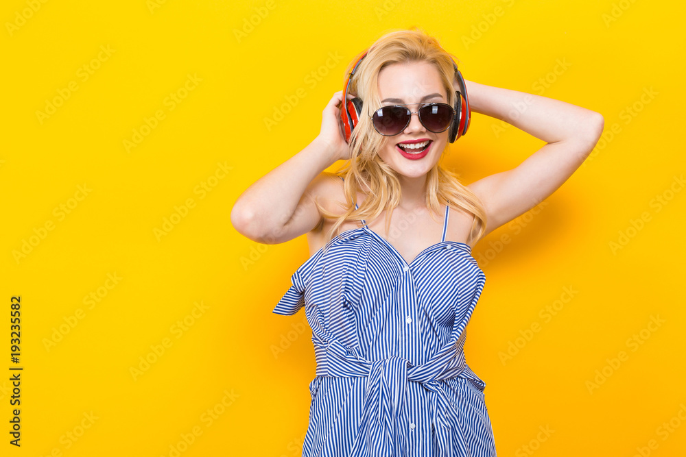 Girl in blouse with headphones and sunglasses Girl in blouse with headphones and sunglasses