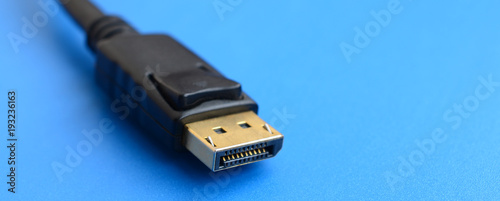 20-pin male DisplayPort gold plated connector for a flawless connection on a blue background photo