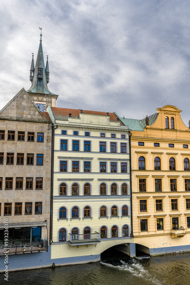 Fototapeta premium Clouds above the block on the Vltava river