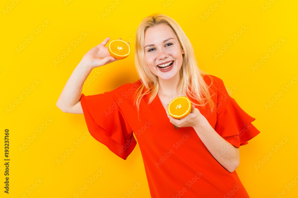 Blonde woman in dress with oranges Blonde woman in dress with oranges