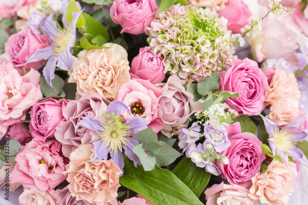 Close-up beautiful luxury bouquet of mixed flowers in glass vases. the work of the florist at a flower shop. Wallpaper