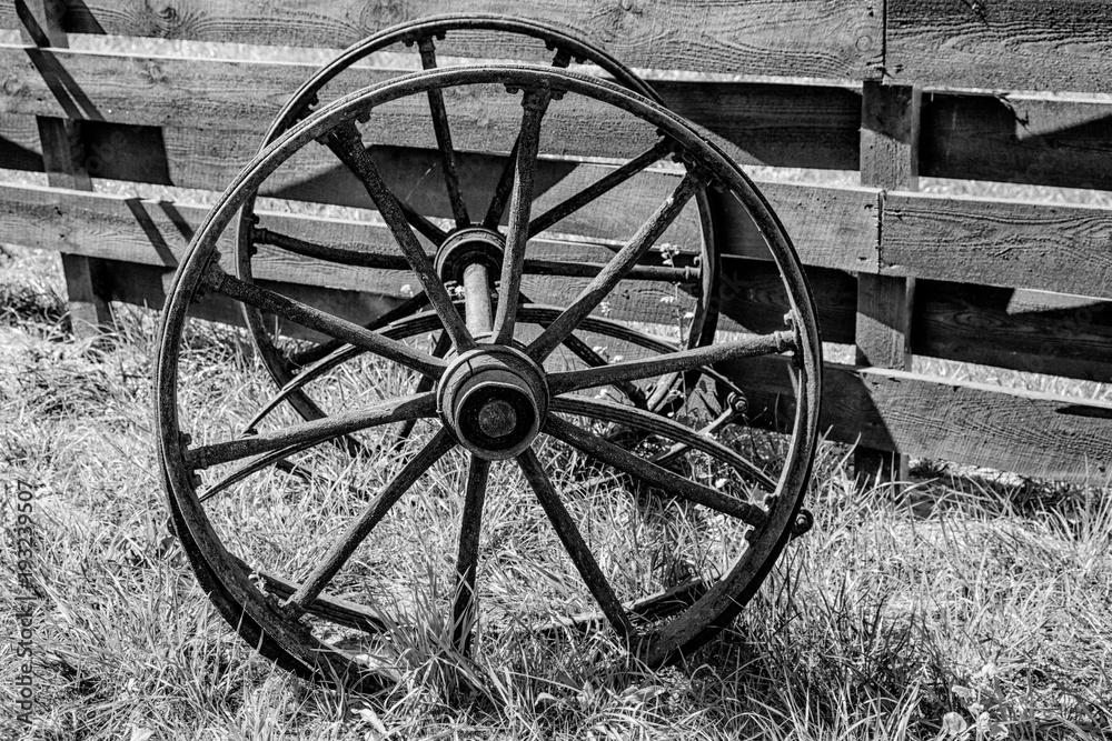 wooden wheels from an old wagon. black and white photography