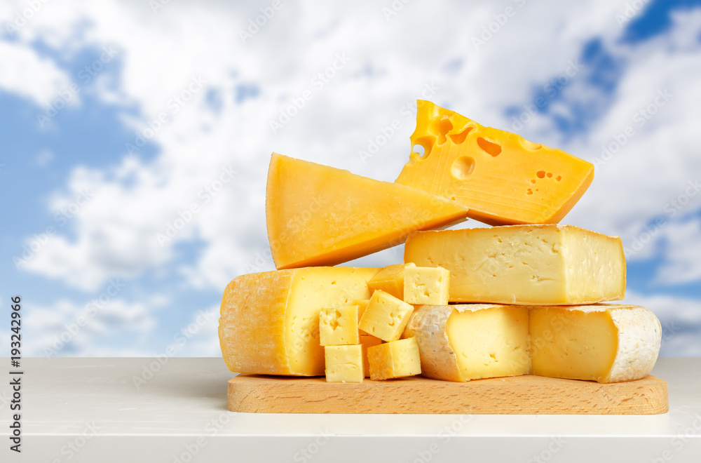 Fototapeta premium cheese on wooden table